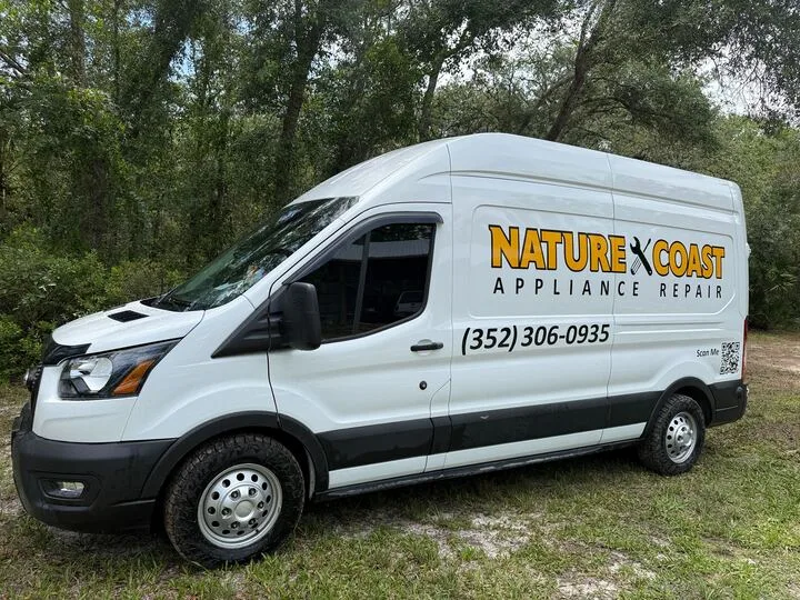White van with "NATURE X COAST APPLIANCE REPAIR" and phone number (352) 306-0935 on the side.